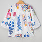 Floral Print Tassel Tie Bracelet Sleeve Flowy Blouse